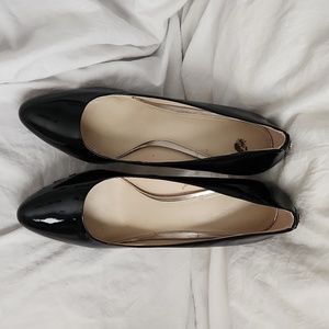 Black patent Coach pumps